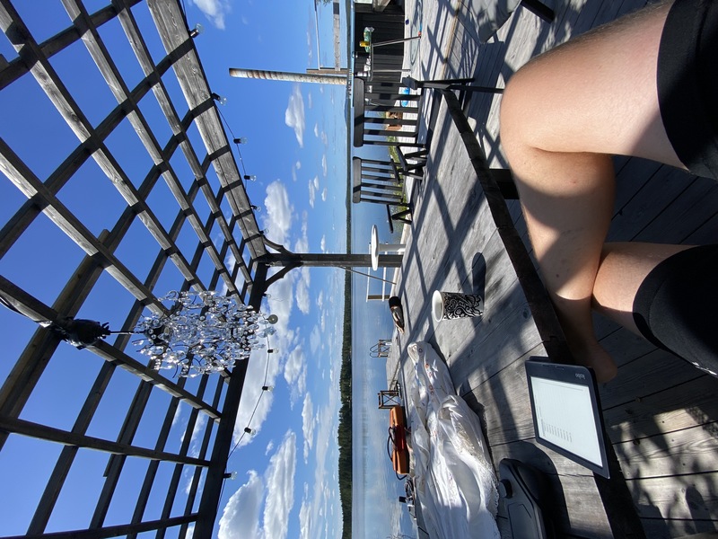 Having a break in Malå during my ride, reading by the lake