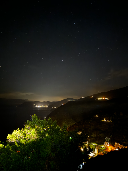 A starry sky, blended with lights from one of the five villages