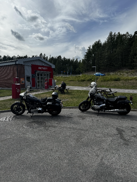 Our bikes lined up at a gas station