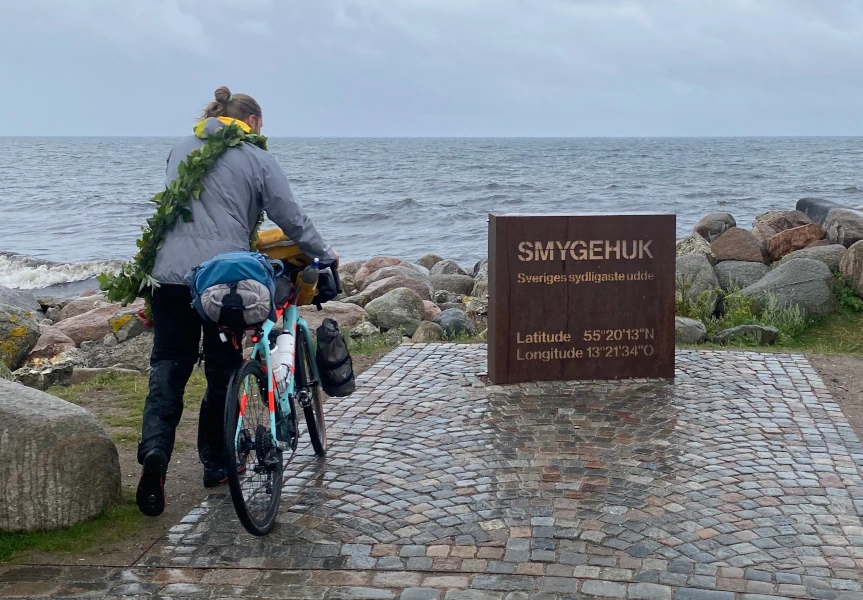 Jumping of the bike in right at the monument for the southernmost spot of Sweden